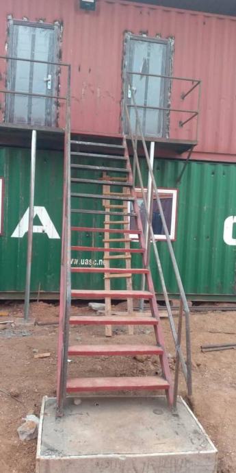 Steel staircase to upper container rooms